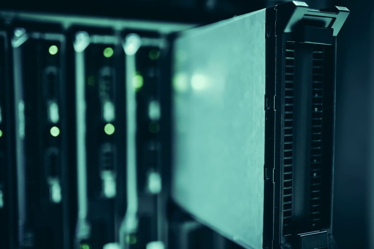 Close-up of server blades with status lights in a data centre